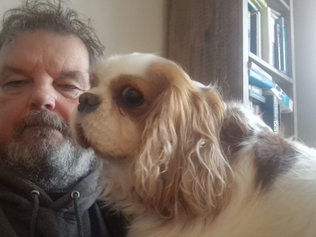 Derek "Del" chambers sitting on the sofa after a dog walk